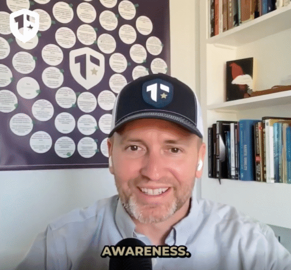Coach Brandon Jenkins writes about being a strong team. Image is of a video still where Brandon is sitting in front of his Blueprint and bookshelf.